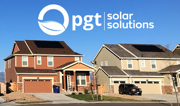 Residential homes with black solar PV systems by PGT Solar Solutions.